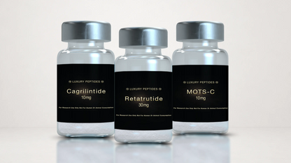 Three Luxury Peptides research vials labeled Cagrilintide 10mg, MOTS-C 10mg, and Retatrutide 30mg displayed on a neutral background with a soft reflective surface.