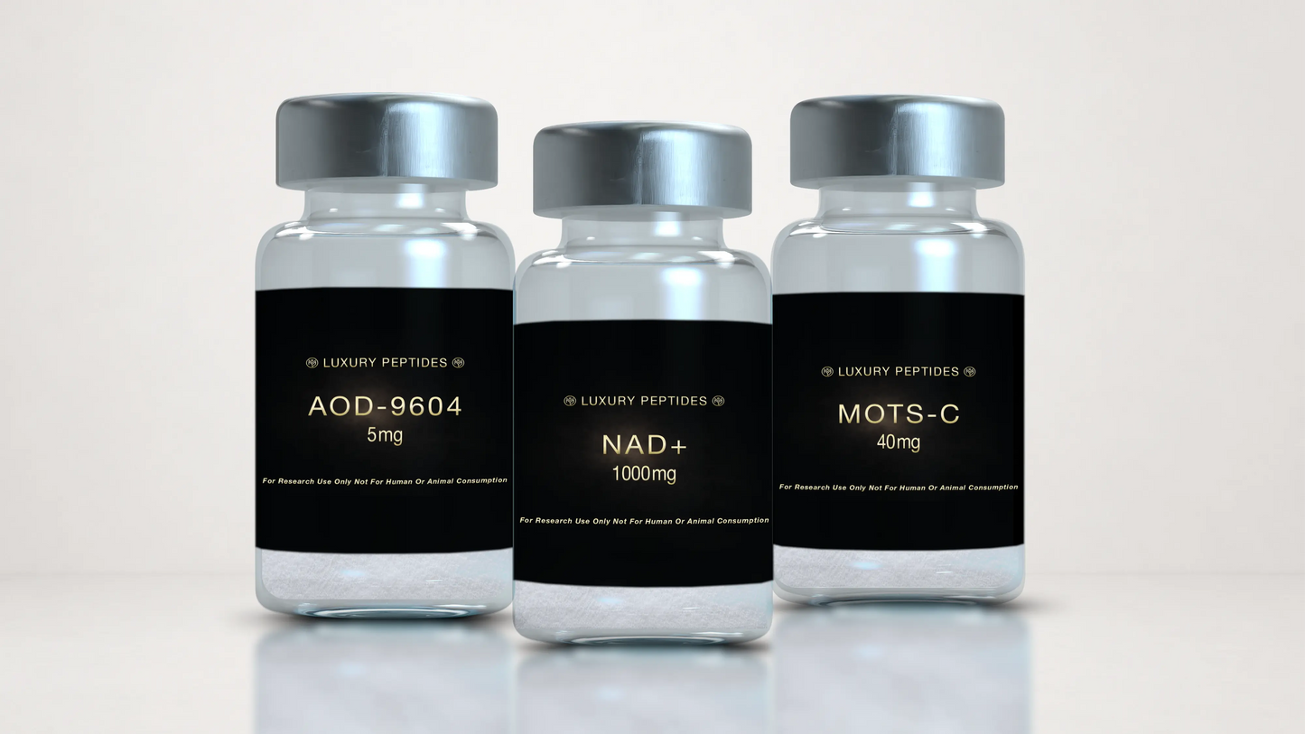 Three Luxury Peptides research vials labeled AOD-9604 5mg, MOTS-C 40mg, and NAD+ 1000mg displayed on a neutral background with a soft reflective surface.