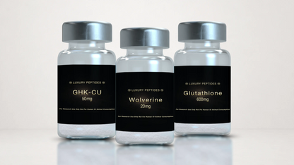 Three Luxury Peptides research vials labeled Wolverine 20mg, GHK-Cu 50mg, and Glutathione 600mg displayed on a neutral background with a soft reflective surface.